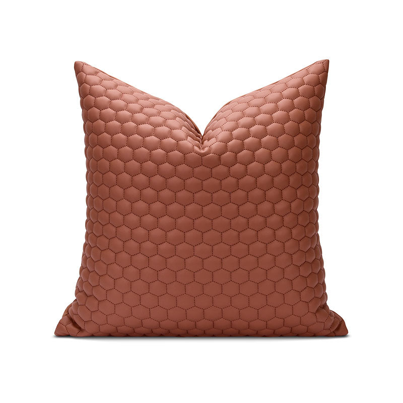 A brown pillow with a hexagon pattern