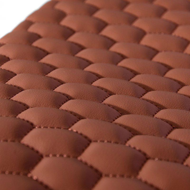 A brown pillow with a hexagon pattern