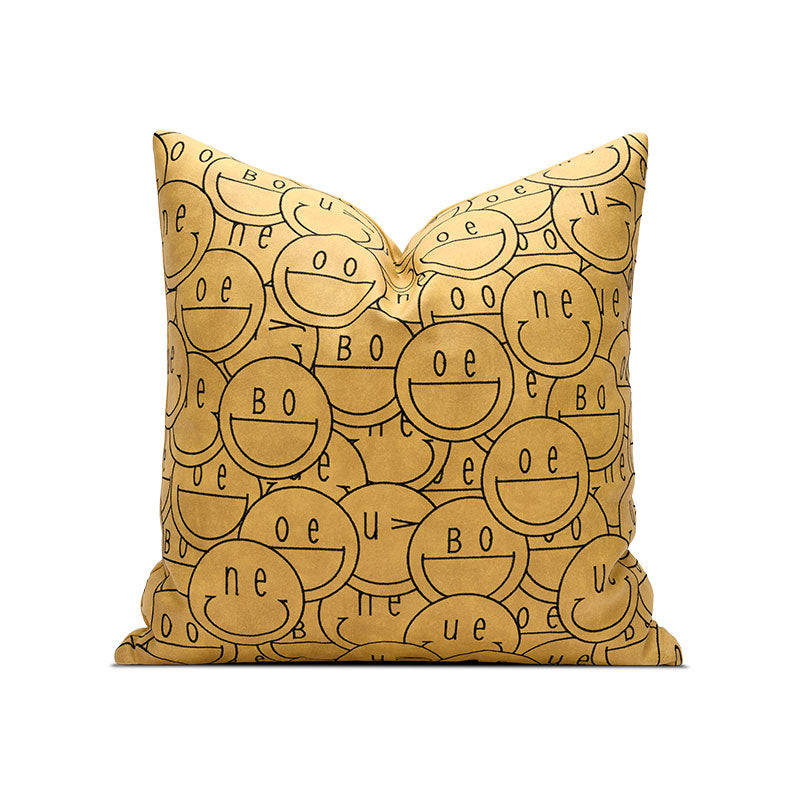 A pillow with smiley faces on it.